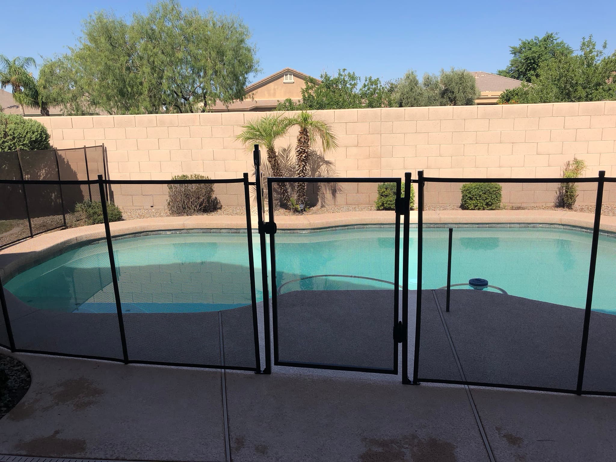 Professional removable mesh pool fence — Arizona backyard installation