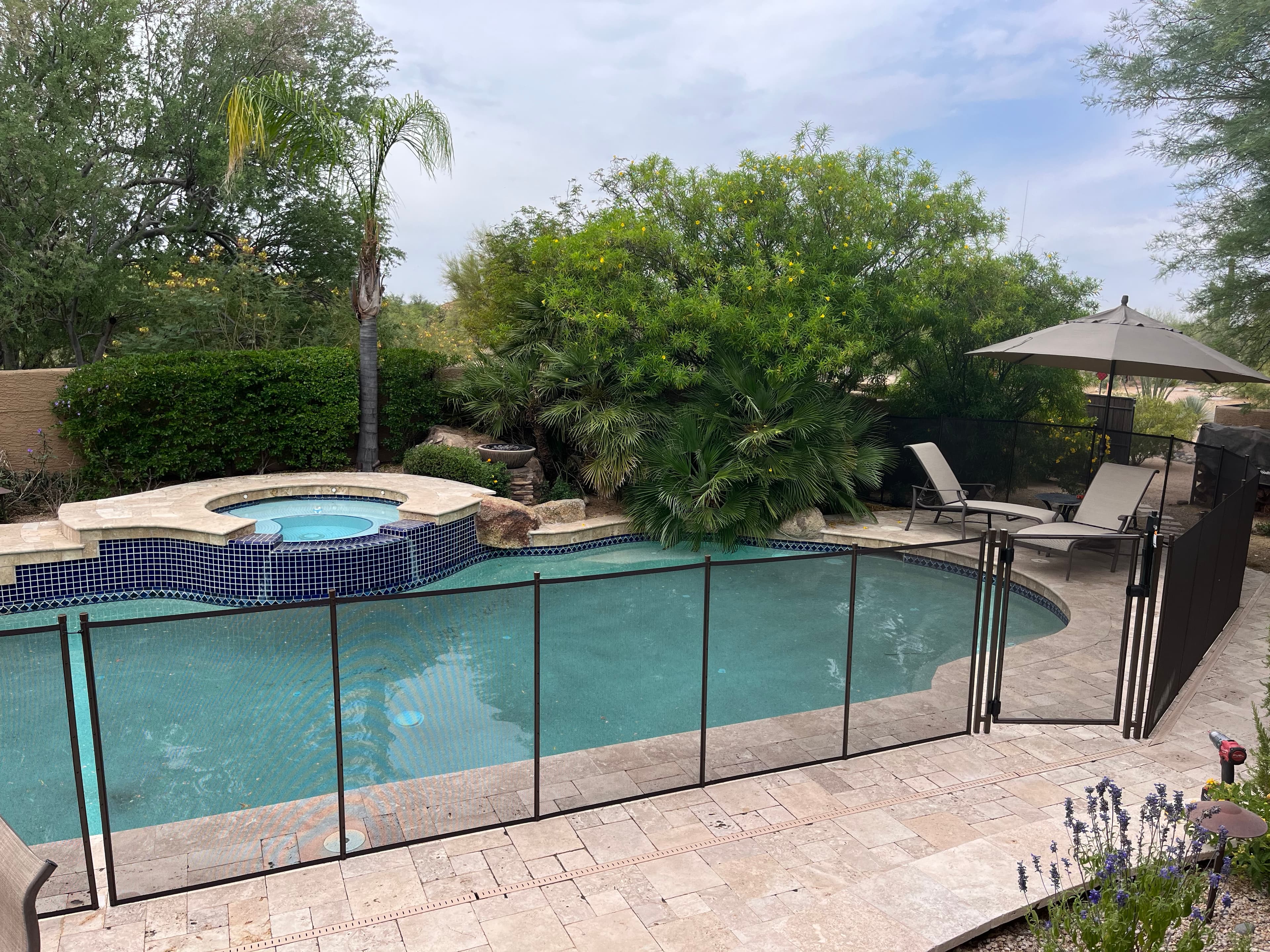 Completed removable mesh pool fence — Arizona residential project