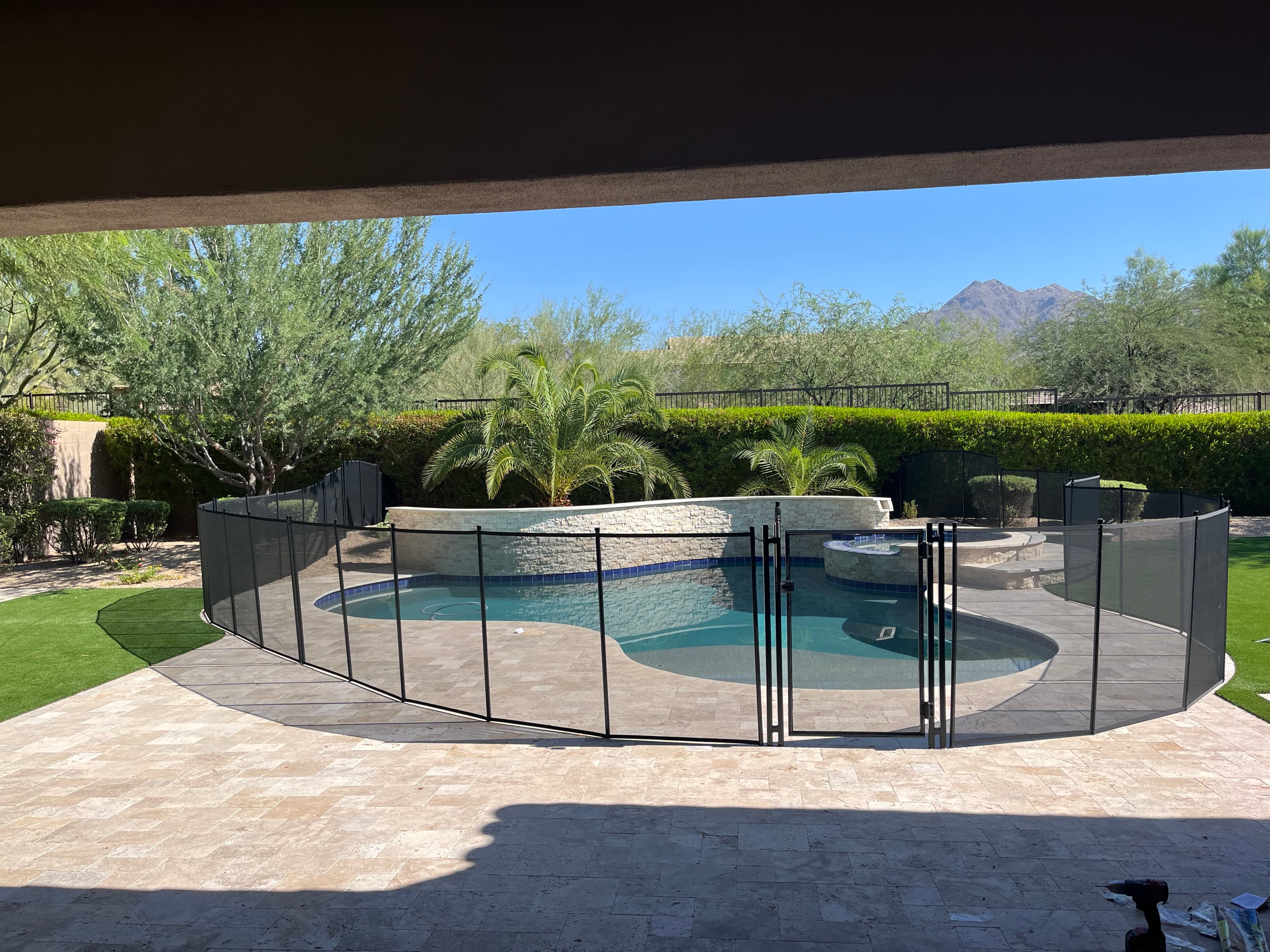 Pool fence backyard installation — black mesh, Maricopa County AZ