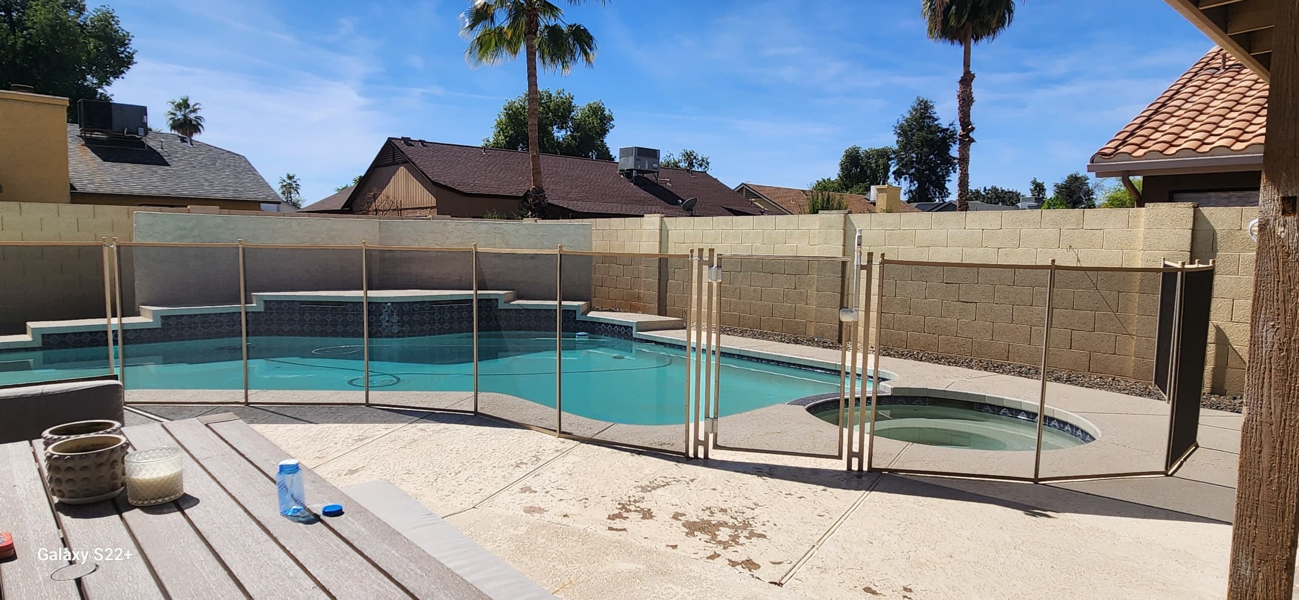 Beige mesh pool fence around pool and spa — Scottsdale AZ installation