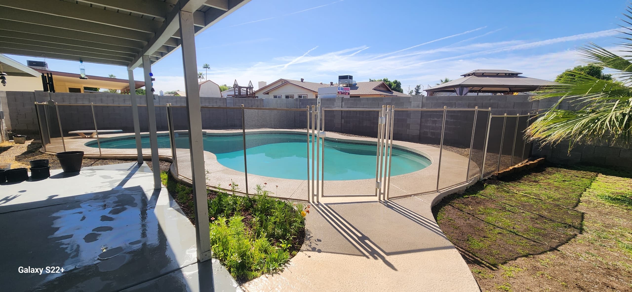 Beige mesh pool fence around round pool — Maricopa County AZ